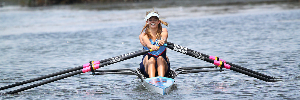 Woman rowing kayak on river